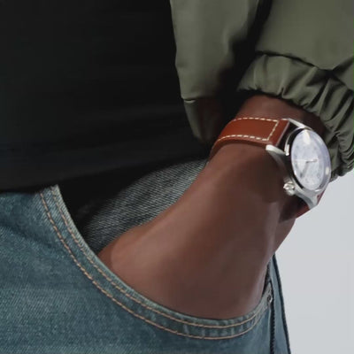 Hamilton Khaki Field H70455553 silver dial with Arabic numerals and date window close-up 
