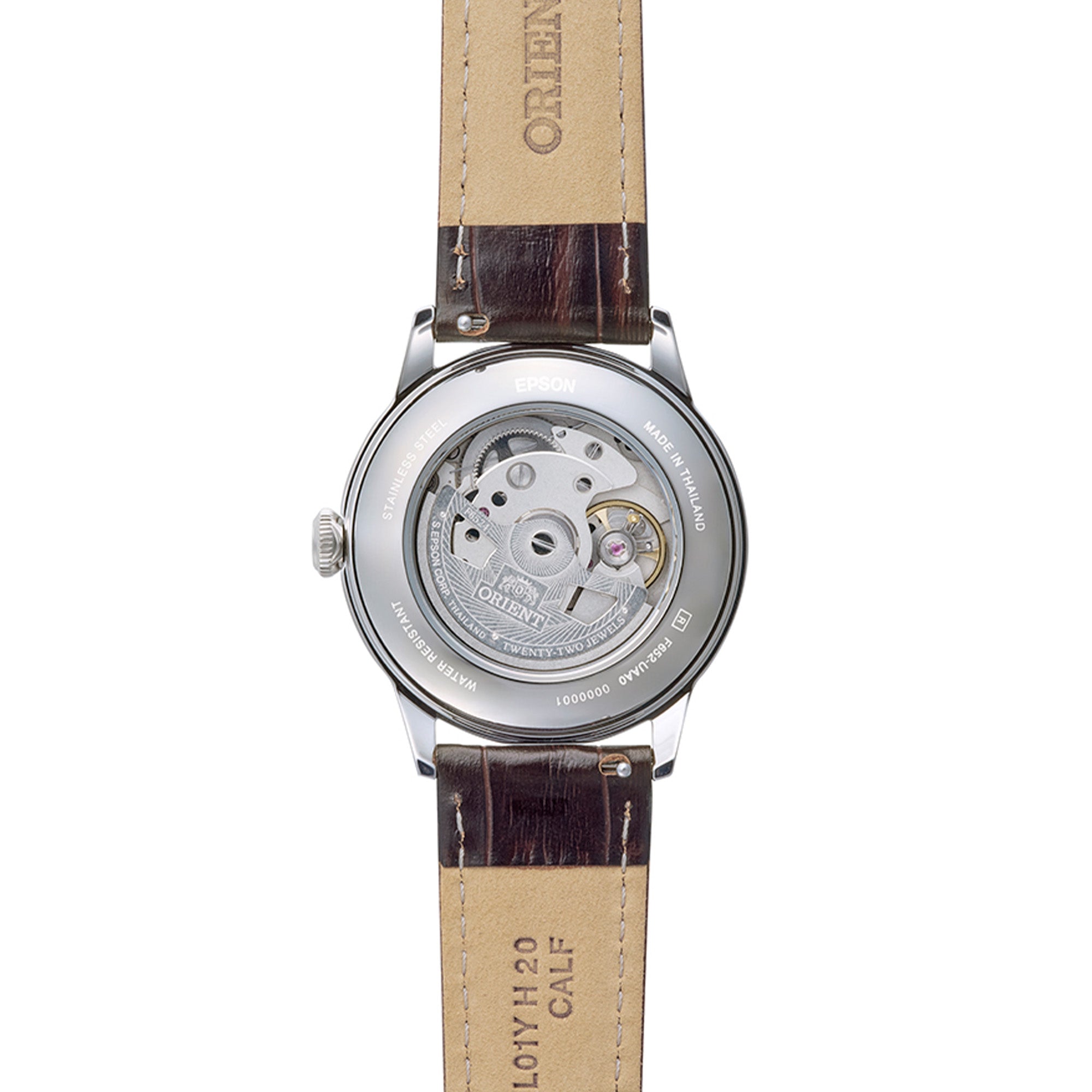 Transparent exhibition caseback revealing the automatic movement of an Orient Bambino watch with a leather strap