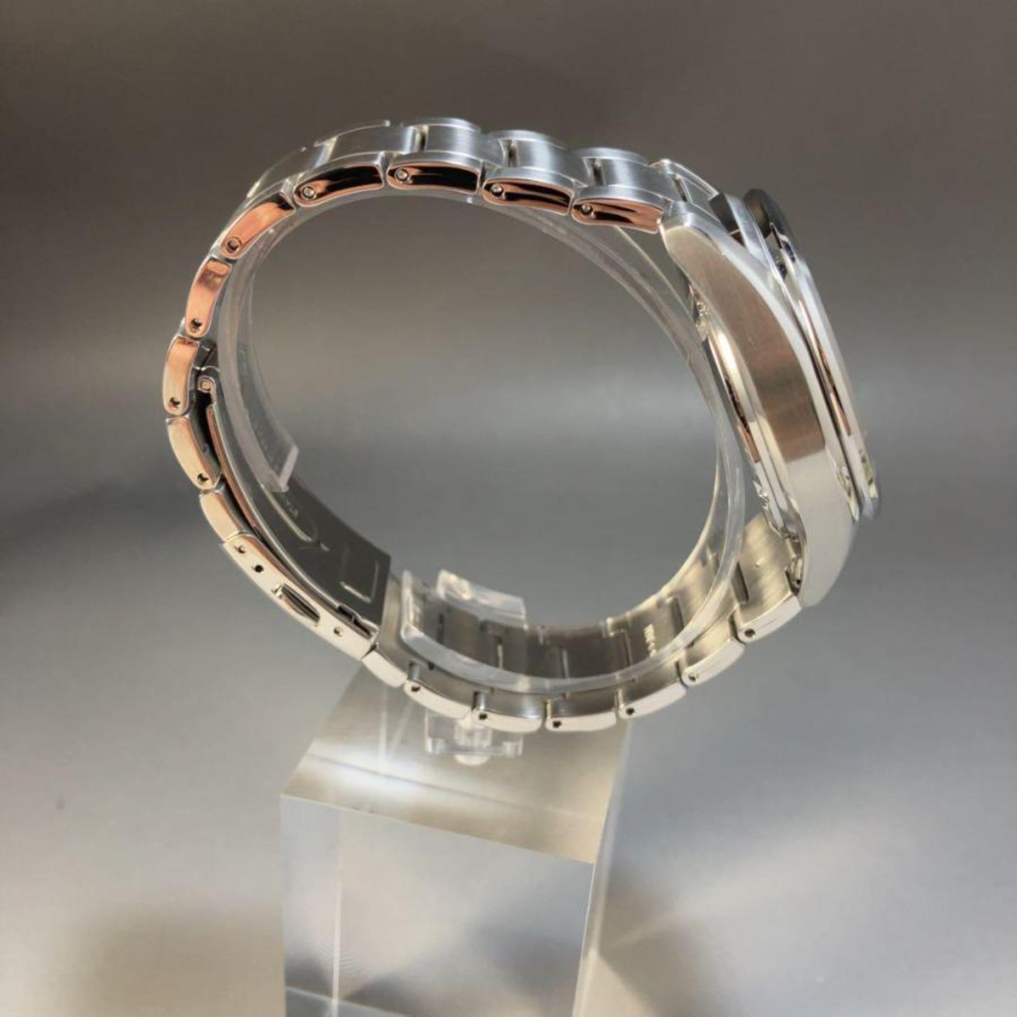 Full side profile view of a Seiko Essentials Solar Chronograph watch SSC801P1 showing the curvature of the stainless steel link bracelet and the side of the watch